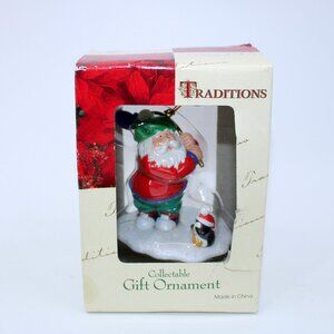 Traditions Westmar Santa Golfing Ornament with Penguin